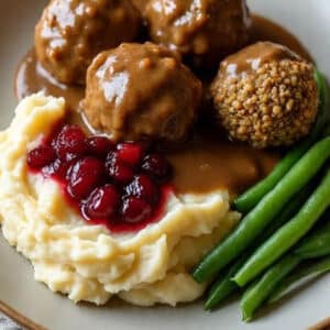 Option 1 - Thanksgiving Main - Lentil balls with mushroom gravy, mashed potatoes with cauliflower, green beans and cran-cherry sauce.
